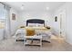 Bright bedroom showcasing a bed with plush pillows and ample natural light at 17616 Bluetrail Ave, Parker, CO 80134