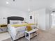 Bright bedroom showcasing a bed with plush pillows and ample natural light at 17616 Bluetrail Ave, Parker, CO 80134