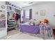 Charming bedroom with a bed, storage, and purple decor at 17616 Bluetrail Ave, Parker, CO 80134