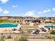 Community recreation area featuring pools, picnic tables, and ample space for outdoor activities and gatherings at 17616 Bluetrail Ave, Parker, CO 80134