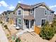 Charming townhome with muted siding, a small front porch, and low-maintenance landscaping at 17616 Bluetrail Ave, Parker, CO 80134