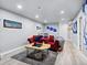 Finished basement featuring comfortable seating, a rug, and television, ideal for entertainment at 17616 Bluetrail Ave, Parker, CO 80134