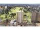 Aerial view of a building complex surrounded by lush greenery and city streets at 1201 N Williams St # 16A, Denver, CO 80218