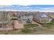 Aerial view of the home features a well-maintained backyard, stone patio, and landscaping, enhancing outdoor living at 7154 E 131St Pl, Thornton, CO 80602