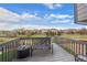 Cozy deck features a wrought-iron bench, offering scenic views of the surrounding neighborhood and a peaceful ambiance at 7154 E 131St Pl, Thornton, CO 80602
