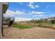 Fenced backyard boasts a stone patio and lush lawn, ideal for outdoor relaxation and entertaining, offering privacy at 7154 E 131St Pl, Thornton, CO 80602