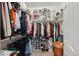 Organized walk-in closet with ample hanging and shelving space for clothes and accessories, well-managed at 7154 E 131St Pl, Thornton, CO 80602