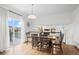 Dining room with light fixture and an outdoor view on a sunny day at 7154 E 131St Pl, Thornton, CO 80602