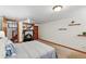 Finished basement bedroom with carpet, wall decor, workspace, and bonus room at 3611 N Vine St, Denver, CO 80205
