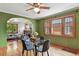 Cozy dining room with hardwood floors and windows offering natural light, adjacent to a living room at 3611 N Vine St, Denver, CO 80205