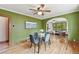 Charming dining room with a glass table set and view into a bright living room at 3611 N Vine St, Denver, CO 80205