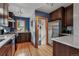 Modern kitchen showcasing stainless steel appliances and hardwood floors, filled with natural light at 3611 N Vine St, Denver, CO 80205
