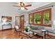 Inviting living room with hardwood floors, large windows, and comfortable seating arrangements at 3611 N Vine St, Denver, CO 80205