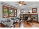 Comfortable living room with hardwood floors, a cozy sofa, and a decorative fireplace at 3611 N Vine St, Denver, CO 80205