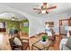 Open-concept living room with hardwood floors and seamlessly connected to the dining area at 3611 N Vine St, Denver, CO 80205