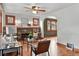 Bright living room featuring hardwood floors, a brick fireplace, and an archway leading to another room at 3611 N Vine St, Denver, CO 80205