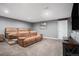 Finished basement featuring comfortable seating and entertainment area at 2906 E 163Rd Ave, Thornton, CO 80602
