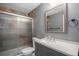 Bathroom with modern vanity and stylish tiled shower at 2906 E 163Rd Ave, Thornton, CO 80602