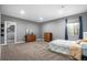 Calm and spacious bedroom with neutral gray walls, soft carpet, and plenty of natural light, perfect for relaxation at 2906 E 163Rd Ave, Thornton, CO 80602
