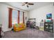 Cozy bedroom with soft carpet, ceiling fan, and a bright window, perfect for a haven at 2906 E 163Rd Ave, Thornton, CO 80602