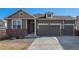 Charming two-story home featuring a three-car garage, brick accents, and well-maintained landscaping at 2906 E 163Rd Ave, Thornton, CO 80602
