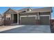 Charming two-story home featuring a three-car garage, brick accents, and well-maintained landscaping at 2906 E 163Rd Ave, Thornton, CO 80602