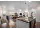 Open-concept kitchen offers a view of the dining and living areas, enhancing the home's spacious feel at 2906 E 163Rd Ave, Thornton, CO 80602