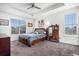 Tranquil main bedroom with large windows, tray ceilings, and ample space at 2906 E 163Rd Ave, Thornton, CO 80602