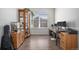 Bright office with natural light, beautiful wooden cabinets, and wood laminate flooring; perfect for work or study at 2906 E 163Rd Ave, Thornton, CO 80602