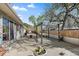 A large concrete patio features a pergola and landscaping at 11707 W 65Th Cir, Arvada, CO 80004