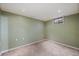 Unfinished basement with painted walls and carpet flooring, ready for customization at 11707 W 65Th Cir, Arvada, CO 80004