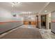 Spacious finished basement includes cabinetry, drink fridge and tiled floors at 11707 W 65Th Cir, Arvada, CO 80004