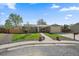 Charming brick home features a manicured front lawn and an attached two-car garage at 11707 W 65Th Cir, Arvada, CO 80004