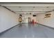 Spacious garage with epoxy flooring and plenty of storage space at 11707 W 65Th Cir, Arvada, CO 80004