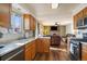 Bright kitchen with a window view and seamless flow into the adjacent living room at 11707 W 65Th Cir, Arvada, CO 80004