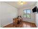 Bright home office with hardwood floors, large window, and outdoor views at 11707 W 65Th Cir, Arvada, CO 80004