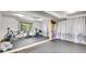 Basement home gym with mirrors, exercise equipment, and curtains for privacy at 30273 Conifer Rd, Evergreen, CO 80439