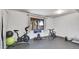 Finished basement home gym with rubber floor, exercise equipment, and natural light at 30273 Conifer Rd, Evergreen, CO 80439