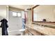 Bathroom featuring a vanity with granite countertop, and shower/tub combination at 30273 Conifer Rd, Evergreen, CO 80439