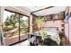 Stylish bedroom with modern décor, wood accents, comfortable bed, and sliding door to deck with hammock at 30273 Conifer Rd, Evergreen, CO 80439