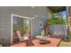 Exterior deck with seating and access to the home, nestled in a wooded area at 30273 Conifer Rd, Evergreen, CO 80439