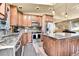 Stylish kitchen with granite countertops, stainless steel appliances, custom cabinets and island at 30273 Conifer Rd, Evergreen, CO 80439