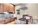 Kitchen with granite countertops, wooden cabinets, and stainless steel appliances at 30273 Conifer Rd, Evergreen, CO 80439