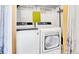 Laundry room featuring side-by-side washer and dryer units, with storage and laundry decor at 30273 Conifer Rd, Evergreen, CO 80439