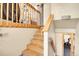 Bright staircase with wood railing leads to upper level and includes exercise area at 30273 Conifer Rd, Evergreen, CO 80439
