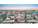 Aerial view of house and neighborhood in winter at 9295 Dunraven Loop, Arvada, CO 80007