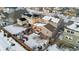 Aerial view of house and neighborhood in winter at 9295 Dunraven Loop, Arvada, CO 80007