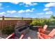 Landscaped backyard with fire pit and seating area at 9295 Dunraven Loop, Arvada, CO 80007