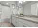 Bright bathroom with double vanity and a bathtub at 9295 Dunraven Loop, Arvada, CO 80007