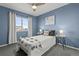 Cozy bedroom with a full-size bed and mountain view at 9295 Dunraven Loop, Arvada, CO 80007